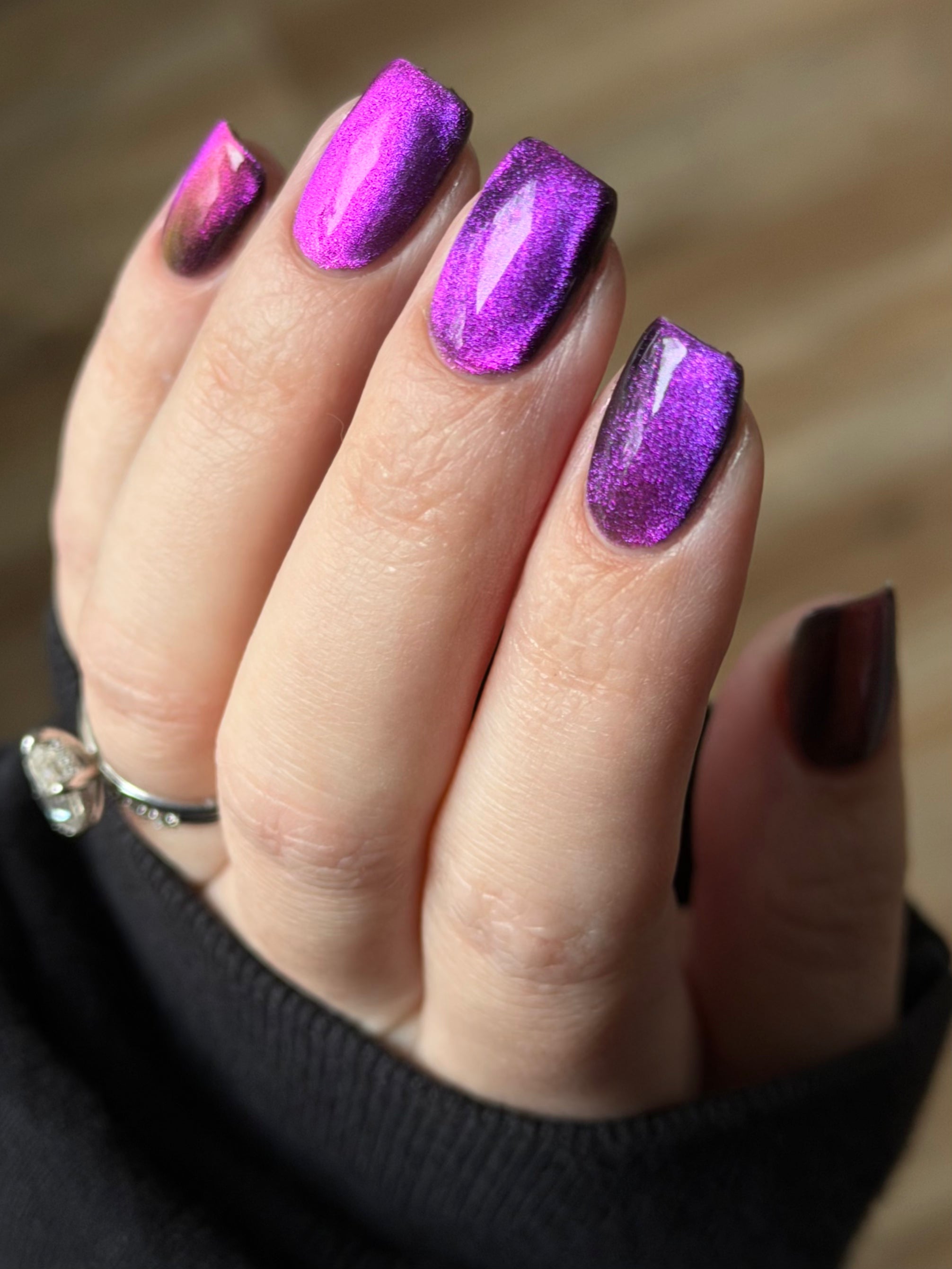 Habibi by Glitch Lacquer, dark magnetic pink-to-purple swatch on light skin, squoval nails