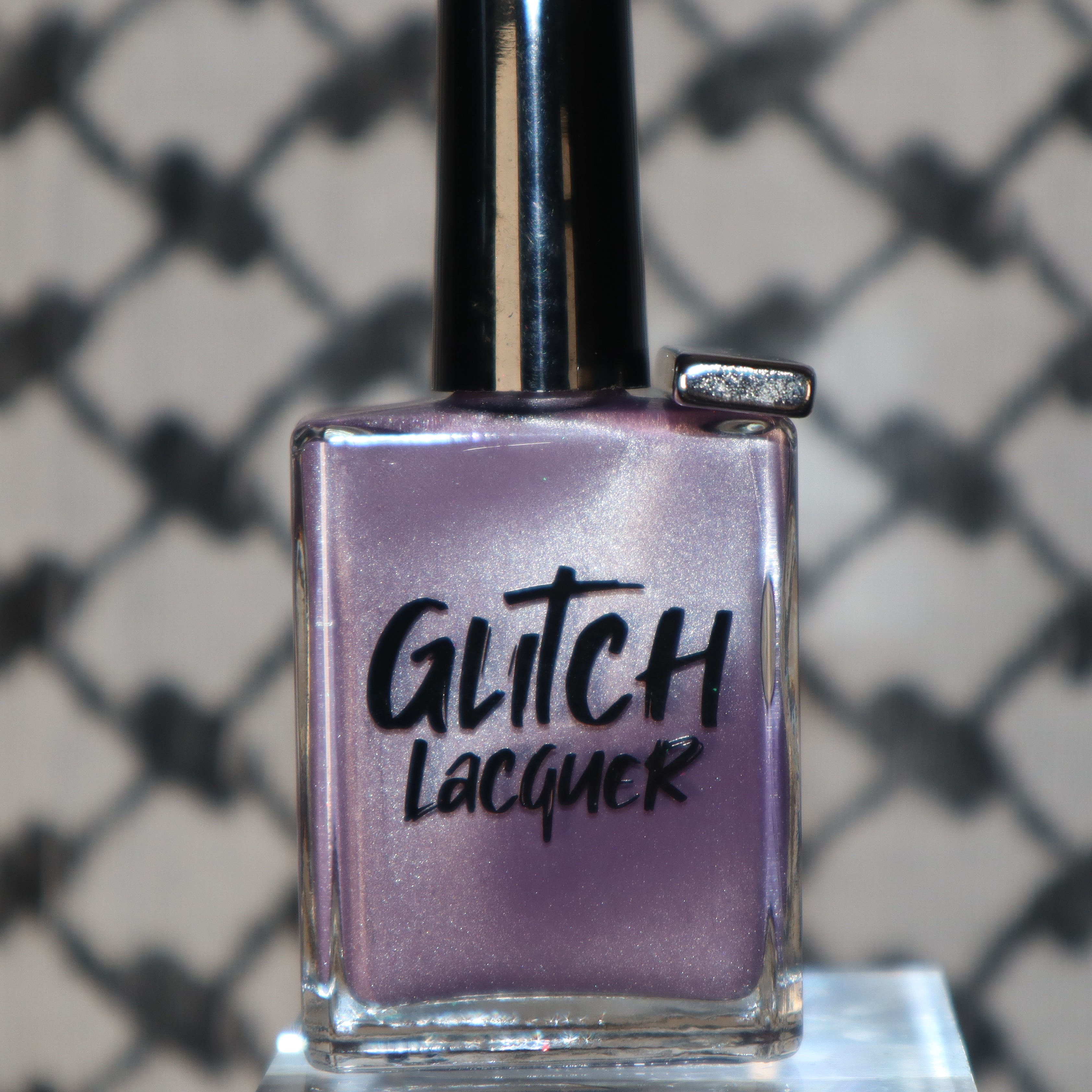 Liberation by Glitch Lacquer, lavender silver magnetic bottle standalone with charm on neck