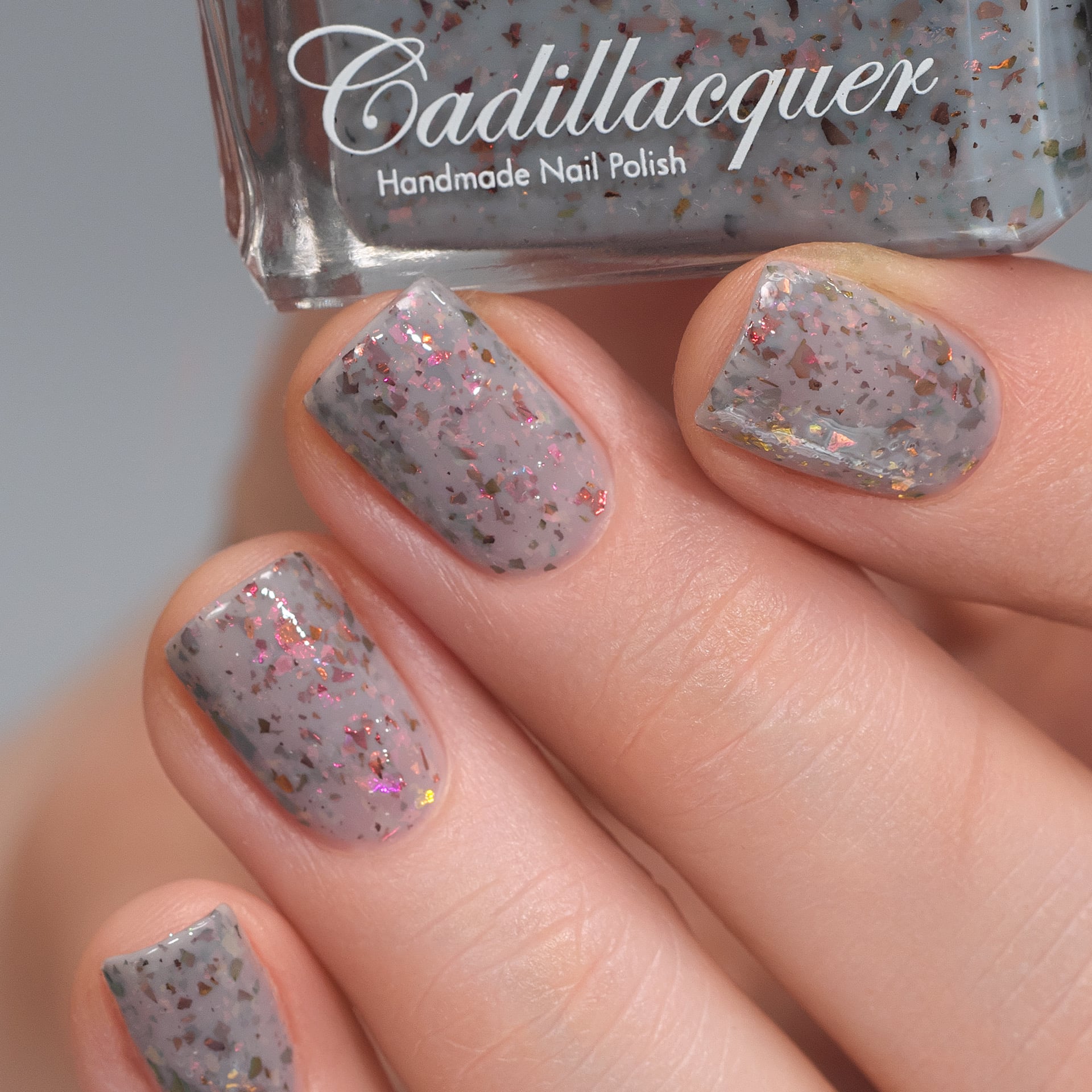 Cadillacquer Daydreaming grey red chameleon iridescent crelly nail polish, swatched on four nails, light skin, studio lighting, by @Lakodzen