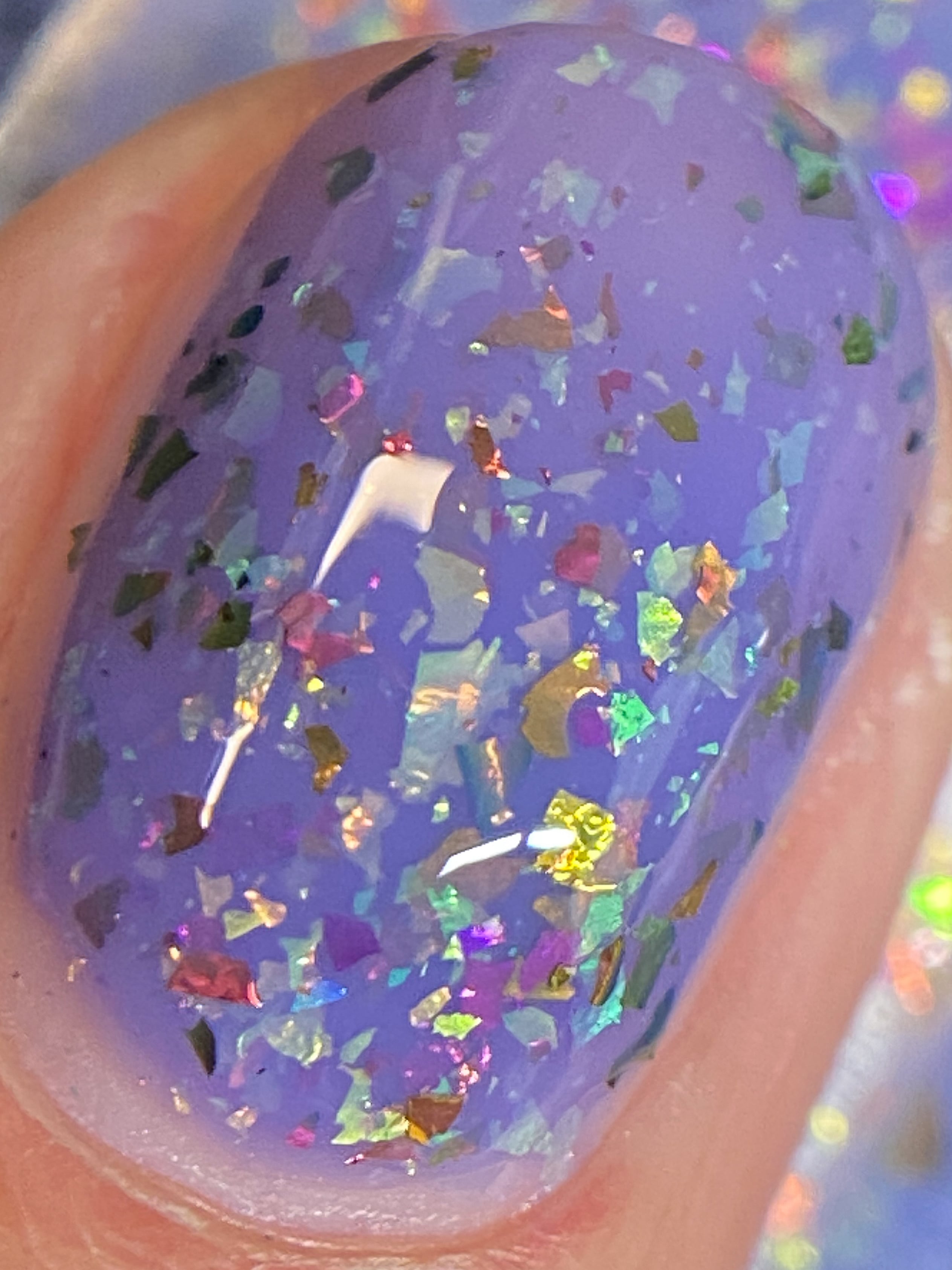 Cadillacquer Don't Worry purple pink chameleon iridescent crelly nail polish, macro single-nail swatch, light skin, bright daylight lighting