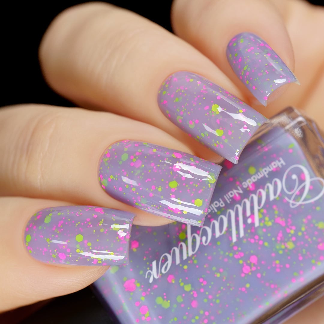 Magical Creatures by Cadillacquer swatched, pastel lilac crelly with neon glitter