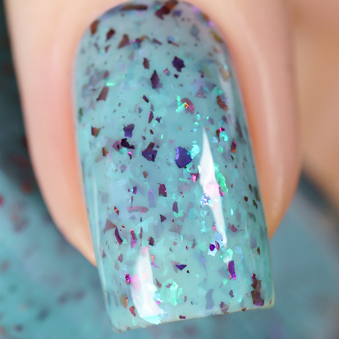 Cadillacquer Pastel Thoughts pastel teal purple chameleon iridescent crelly nail polish, macro single-nail swatch, light skin, studio lighting