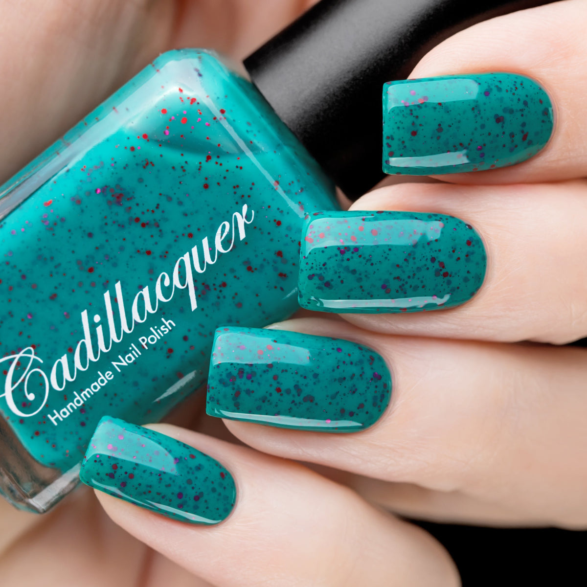 Glitter crelly Cadillacquer nail polish in Siren, a teal crelly with red and garnet red glitter, swatched by @rafinails