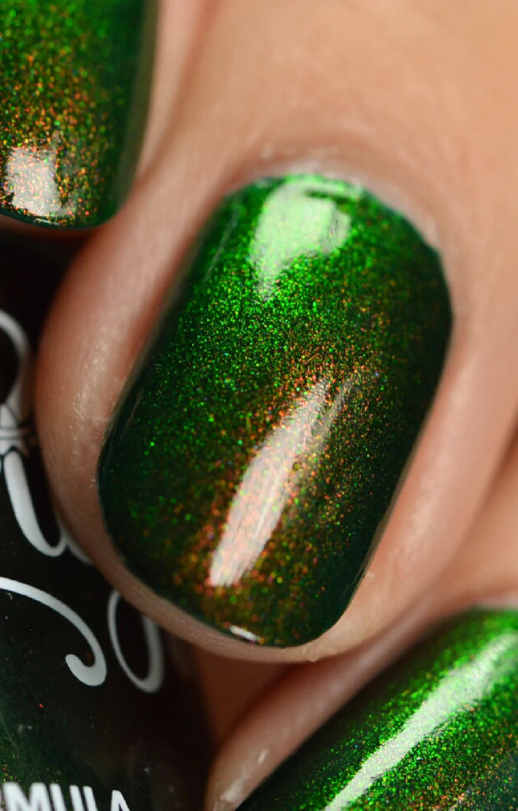 Artemis by Starrily, macro close-up of fine-particle copper-to-bright-green multichrome shimmer over deep forest green base