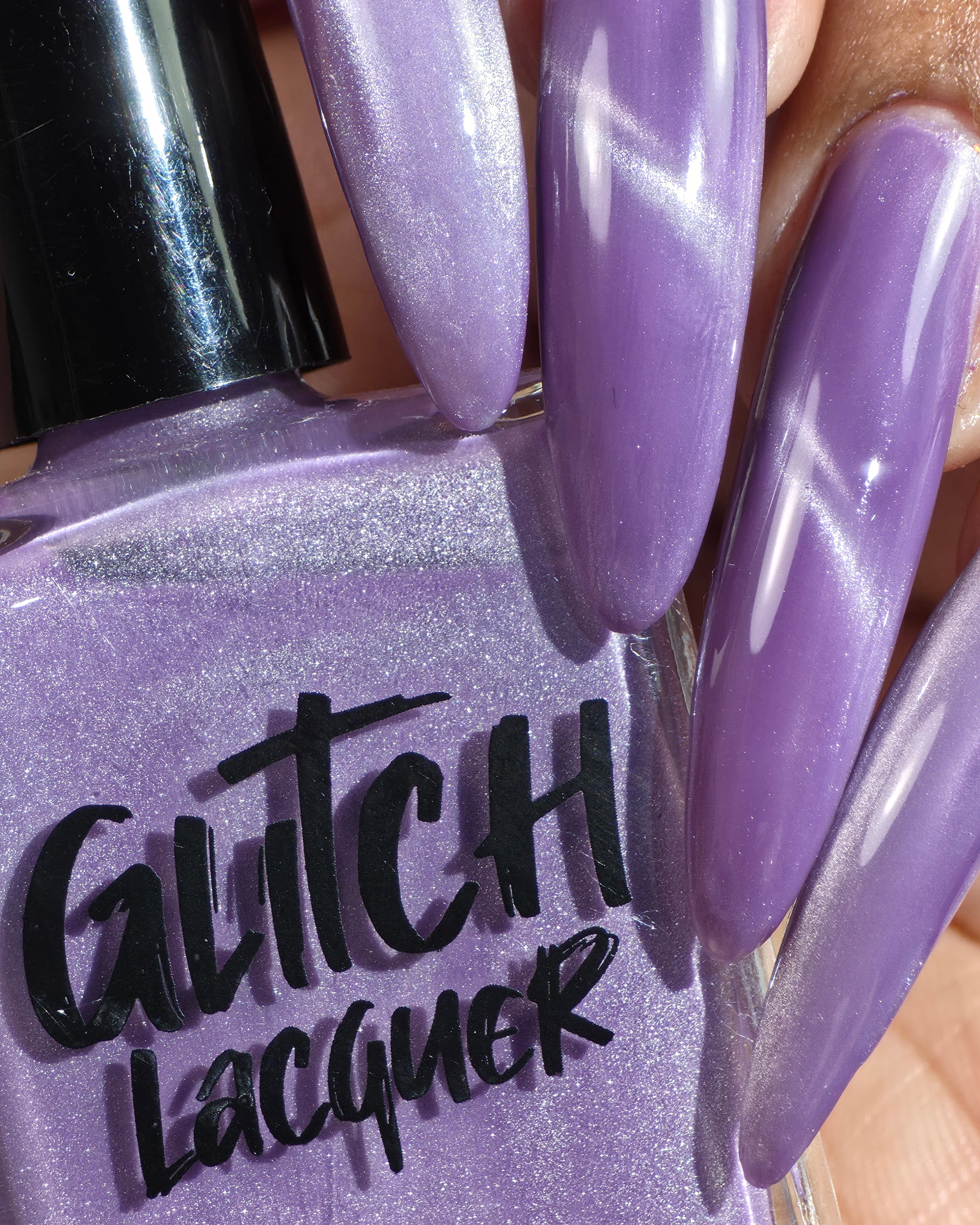Liberation by Glitch Lacquer, lavender silver magnetic bottle and swatch on medium skin tone