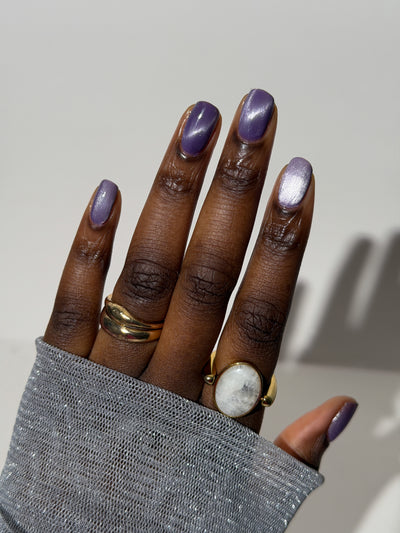 Liberation by Glitch Lacquer, lavender silver magnetic swatch on deep skin tone