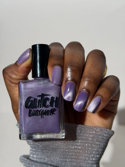 Liberation by Glitch Lacquer, lavender silver magnetic shown on a deep skin tone hand