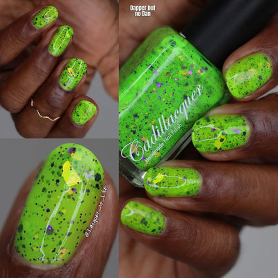 Dapper but no Dan by Cadillacquer, neon lime green glitter flakie with purple glitter and orange-yellow iridescent flakes, bottle held in a rich hand