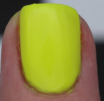 Lightning Speed by 'Ard As Nails, neon yellow-chartreuse creme under direct flash showing full opacity, macro close-up of a single square nail