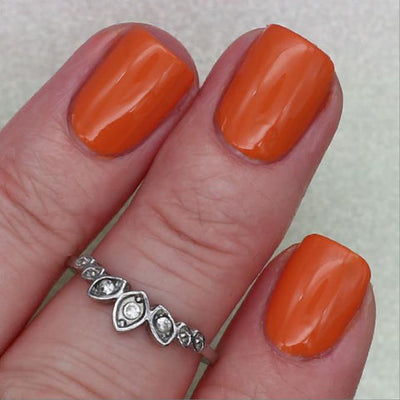Sunset by 'Ard As Nails, dusty burnt orange creme, opaque in bright daylight, on a light skin tone hand