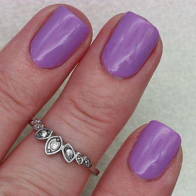 Dusk by 'Ard As Nails, opaque lavender purple creme, on a light skin tone hand