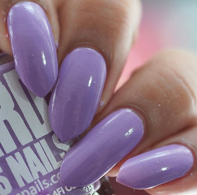 Dusk by 'Ard As Nails, true lavender purple creme with glossy topcoat shine, on a light-medium skin tone hand