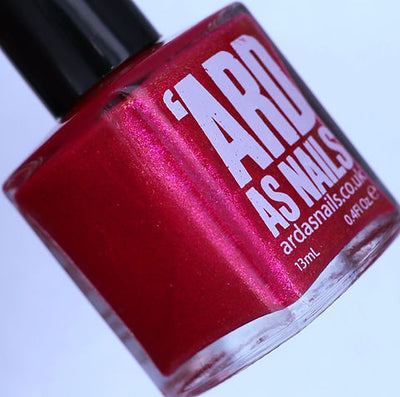 Beach Towel by 'Ard As Nails, deep red base with pink-to-magenta duochrome metallic sheen, bottle standalone product shot