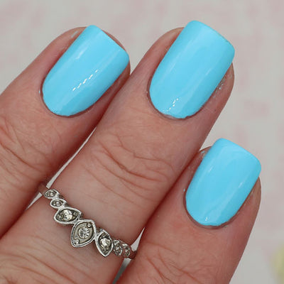 Sky Blue by 'Ard As Nails, robin's egg blue creme with clean glossy finish, on a light skin tone hand