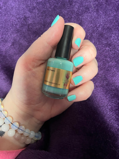 Sea Foam by Prairie Crocus Polish, bright aqua teal creme in daylight, bottle held in a light skin tone hand