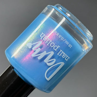 Pro Choice AF by Dam Nail Polish, light blue multichrome shimmer showing pink-to-gold shift, bottle standalone product shot