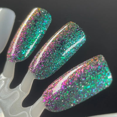 Permit to Hermit by Dam Nail Polish, teal-to-purple-to-pink shifting multichrome flakies with holographic green reflective glitter, swatch stick