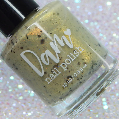 OG Devo-tea by Dam Nail Polish, muted olive-tan crelly shimmer glitter with assorted dark brown-black glitter particles, bottle standalone product shot