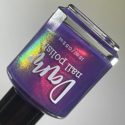 Roe, Roe, Roe Your Vote by Dam Nail Polish, blue-leaning purple multichrome shimmer with concentrated holographic red-to-gold-to-green flare, bottle standalone product shot