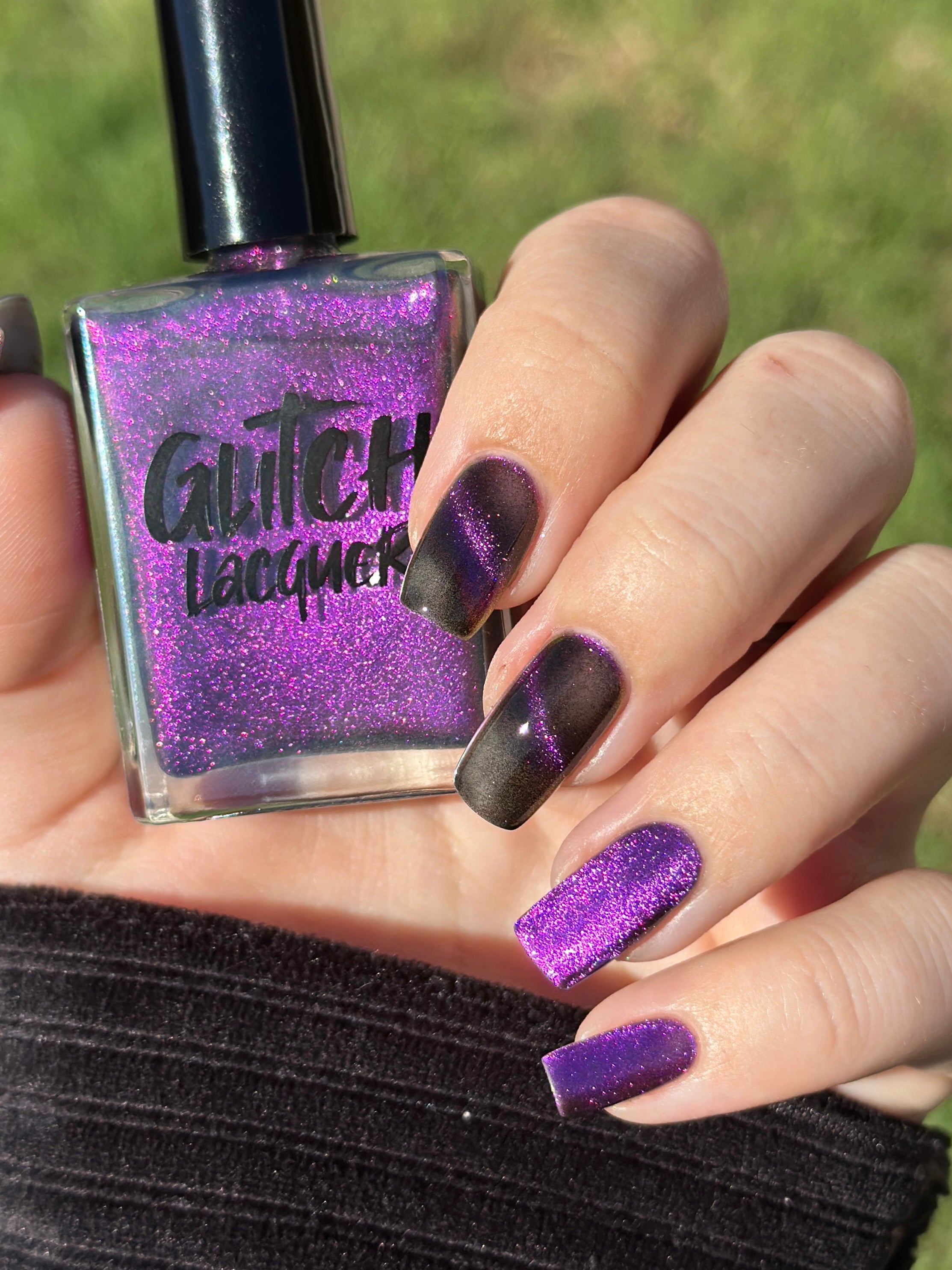 Habibi by Glitch Lacquer, dark purple-pink-gold magnetic bottle and swatch on light-medium skin