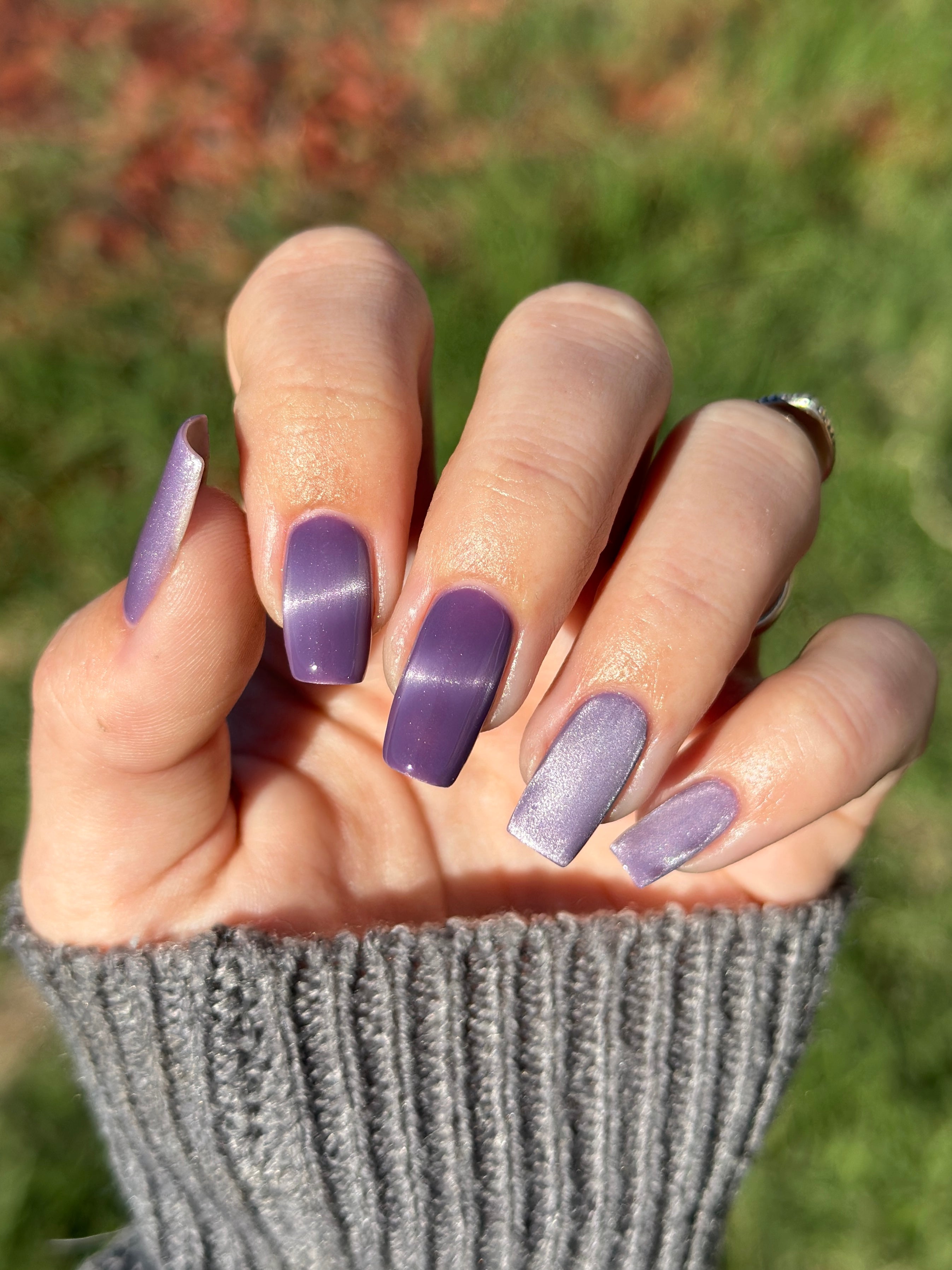 Liberation by Glitch Lacquer, lavender silver magnetic swatch on light-medium skin tone