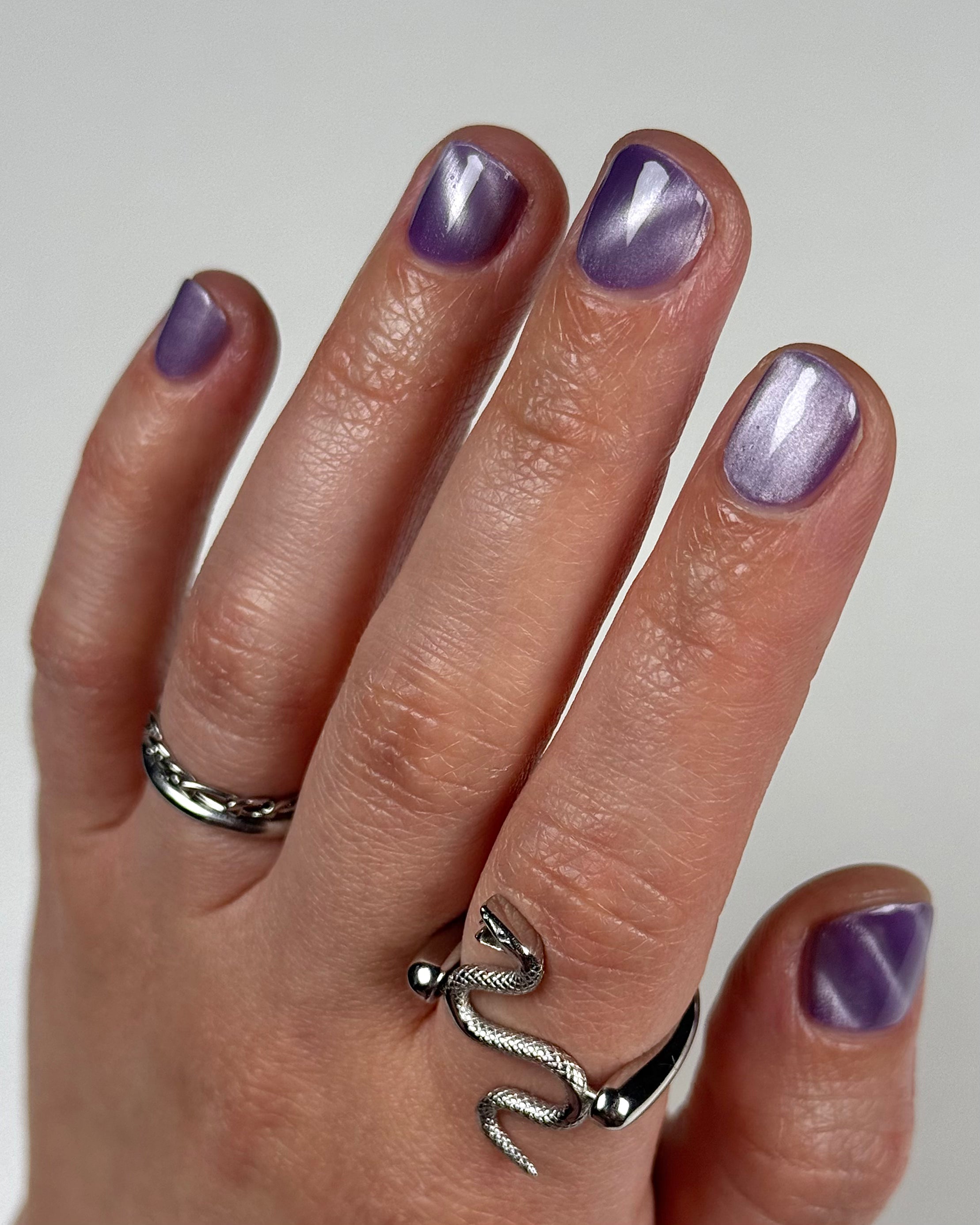 Liberation by Glitch Lacquer, lavender silver magnetic swatch on light-medium skin, studio light