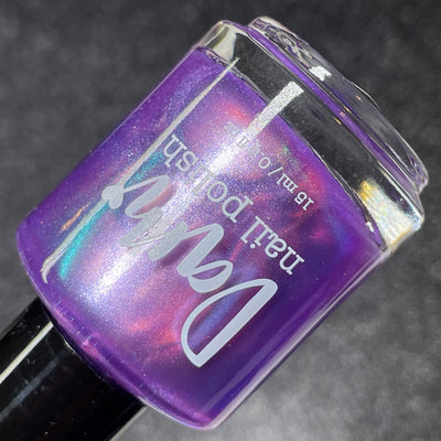 Stay Frosty My Friends by Dam Nail Polish, violet-purple shimmer with pearlescent pink-to-teal color shift, bottle standalone product shot