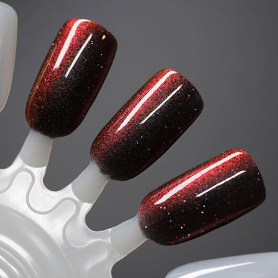 Halloween Quad Full Set by Dam Nail Polish, Hellfire deep crimson-to-black with magnetic cat-eye stripe and scattered red reflective holographic microflakes, swatch stick