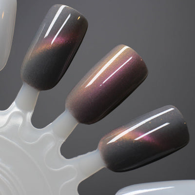 Halloween Quad Full Set by Dam Nail Polish, Flesh of the Undead smoky mauve-grey with gold-to-magenta multichrome shimmer and warm amber-gold cat-eye pull, swatch stick