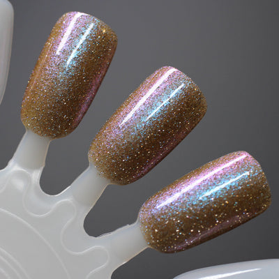 Halloween Quad Full Set by Dam Nail Polish, Field of Screams warm golden amber shifting to dusty pink and teal with holographic and reflective microglitter, swatch stick