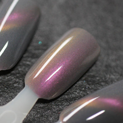 Halloween Quad Full Set by Dam Nail Polish, Flesh of the Undead muted mauve-grey base with dramatic copper-gold to magenta-pink duochrome shift, swatch stick