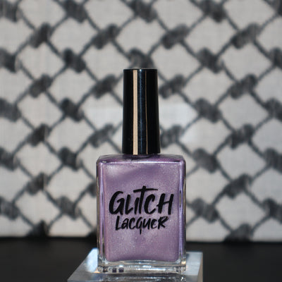 Liberation by Glitch Lacquer, lavender silver magnetic bottle on keffiyeh-patterned background