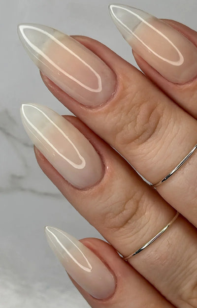 Ghost Jelly by Starrily, soft milky white jelly with glassy gloss finish and natural nail visible beneath, on a light-medium skin tone hand