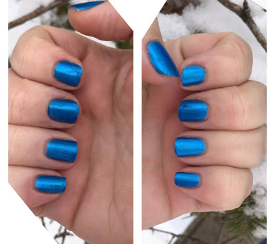 Hype by Prairie Crocus Polish, vibrant cerulean blue with metallic foil shimmer, on a light skin tone hand