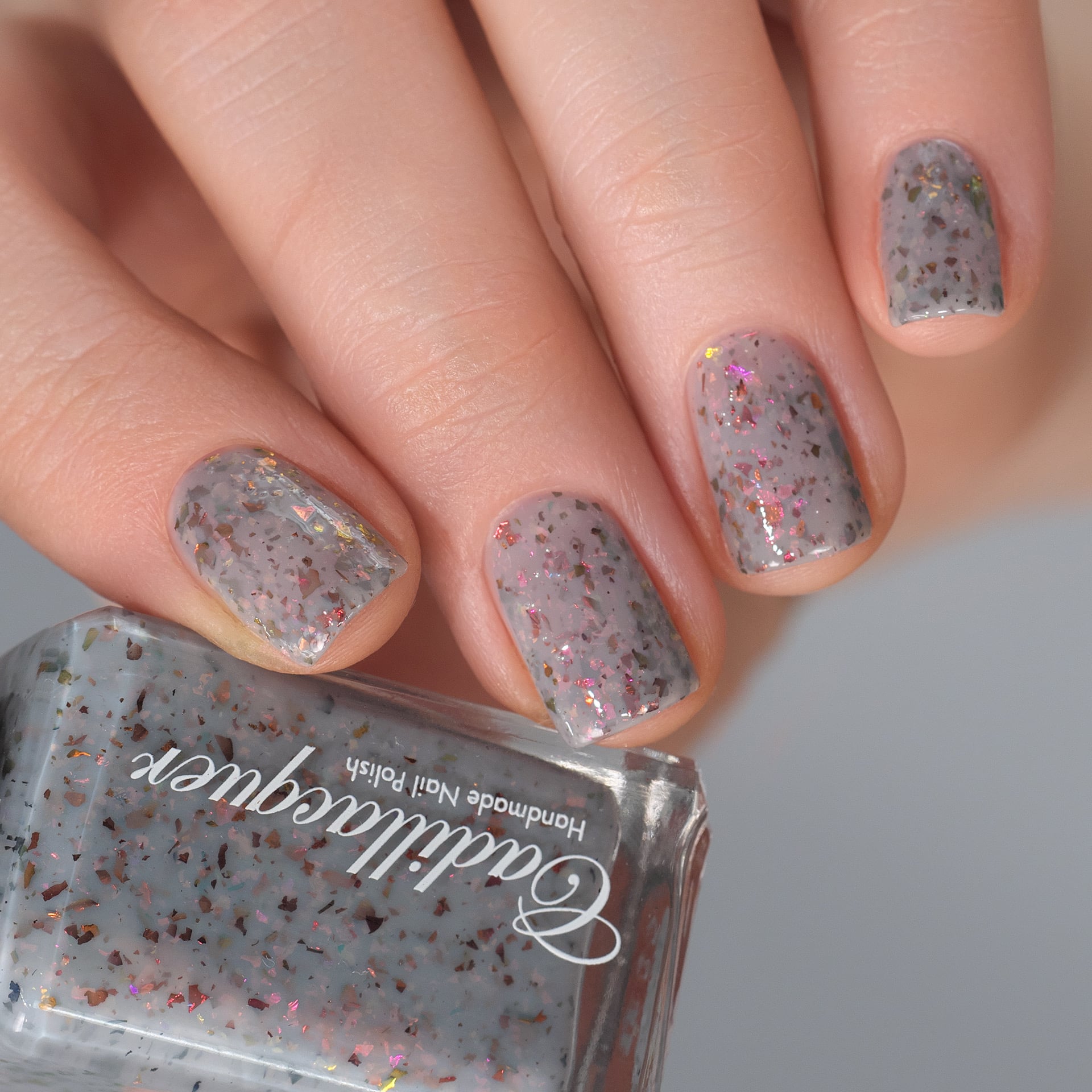 Cadillacquer Daydreaming grey red chameleon iridescent crelly nail polish, swatched on four nails, light skin, studio lighting, by @Lakodzen