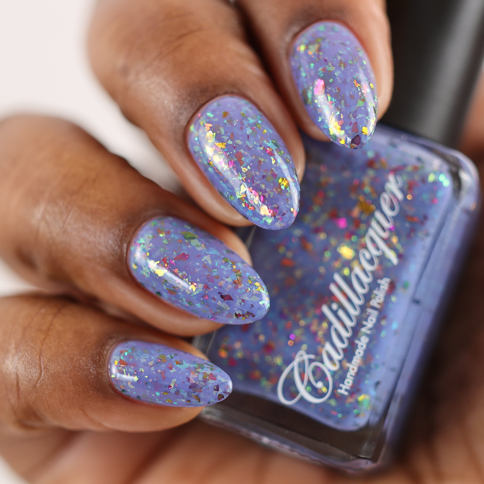 Cadillacquer Don't Worry purple pink chameleon iridescent crelly nail polish, swatched on eight nails, deep skin, studio lighting