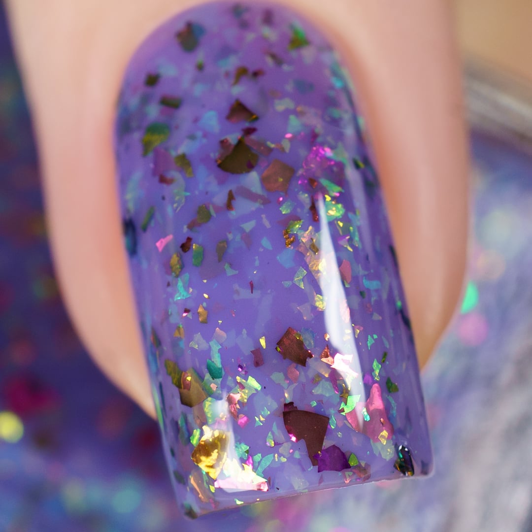 Cadillacquer Don't Worry purple pink chameleon iridescent crelly nail polish, macro single-nail swatch, light skin, studio lighting