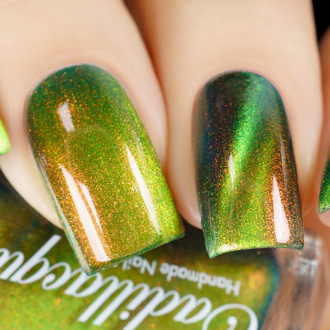 Holographic magnetic multichrome Cadillacquer nail polish in I Found A Place, shown as a close-up swatch on four short natural nails, displaying a deep teal-green carrier base with a bright acid lime-yellow magnetic band, dense red-to-orange aurora shimmer, and fine holographic sparkle throughout, on light skin tone, under studio lighting, swatched by @yyulia_m
