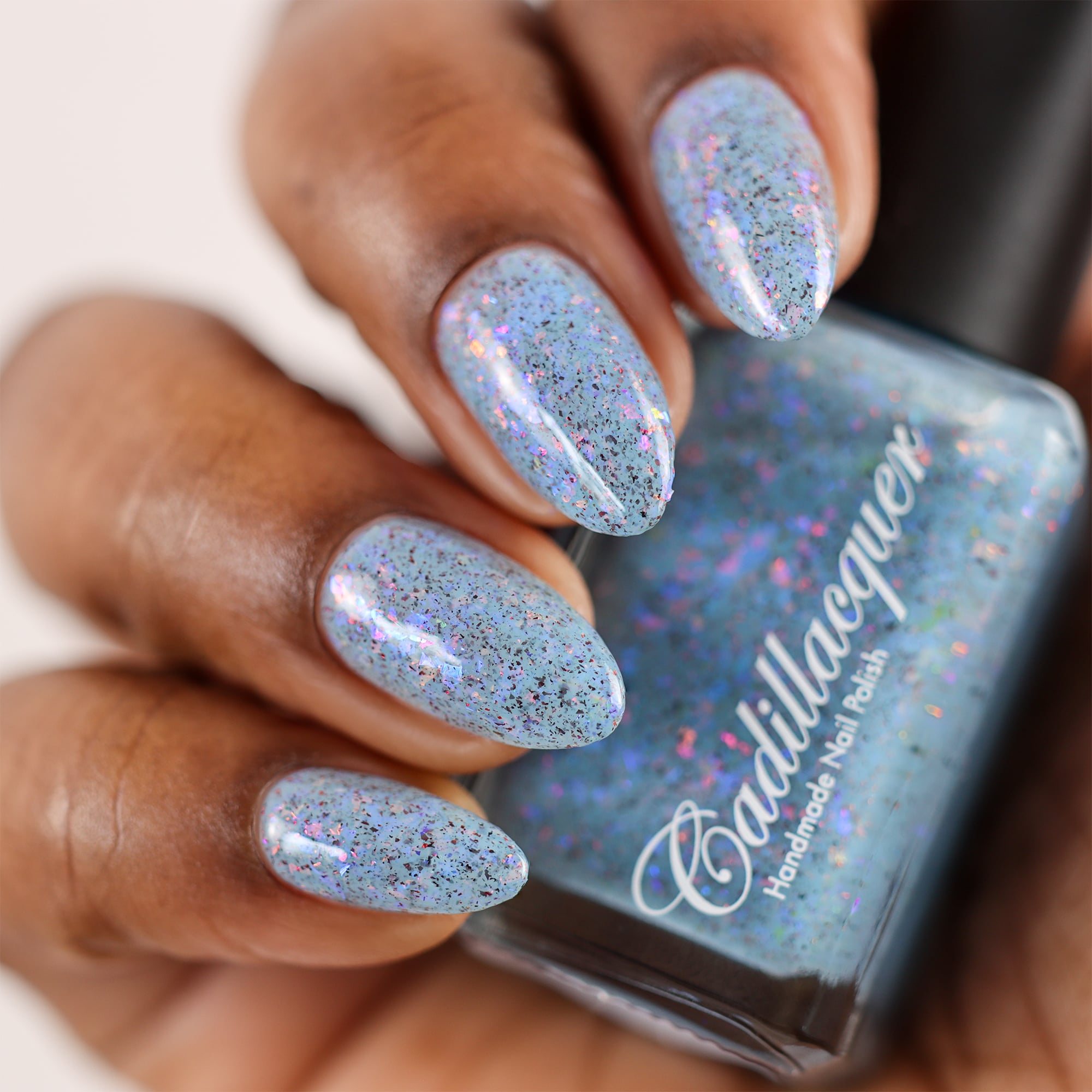 Cadillacquer Just Breathe pastel blue iridescent crelly nail polish, swatched on eight nails, deep skin, studio lighting, by @doseoflolade