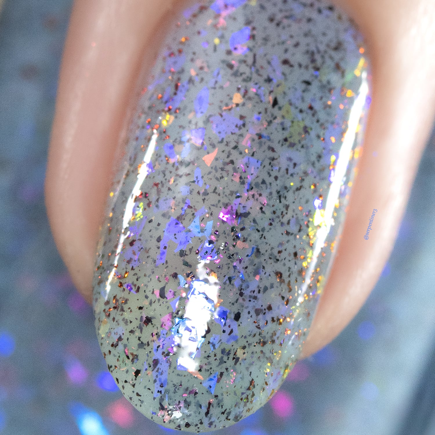 Cadillacquer Just Breathe pastel blue iridescent crelly nail polish, macro single-nail swatch, light skin, studio lighting, by @serpentine13