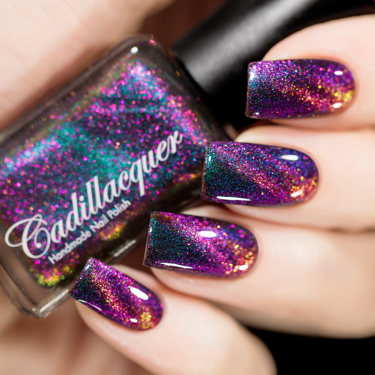 Magnetic flakie multichrome Cadillacquer nail polish in Like A Storm, a green to blue to purple base with magenta to yellow magnetic flakies, swatched by @rafinails