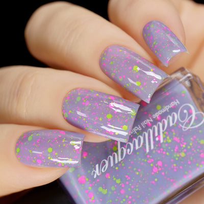 Glitter crelly Cadillacquer nail polish in Magical Creatures, a pastel lilac crelly with matte neon pink and neon green glitter, swatched on nails