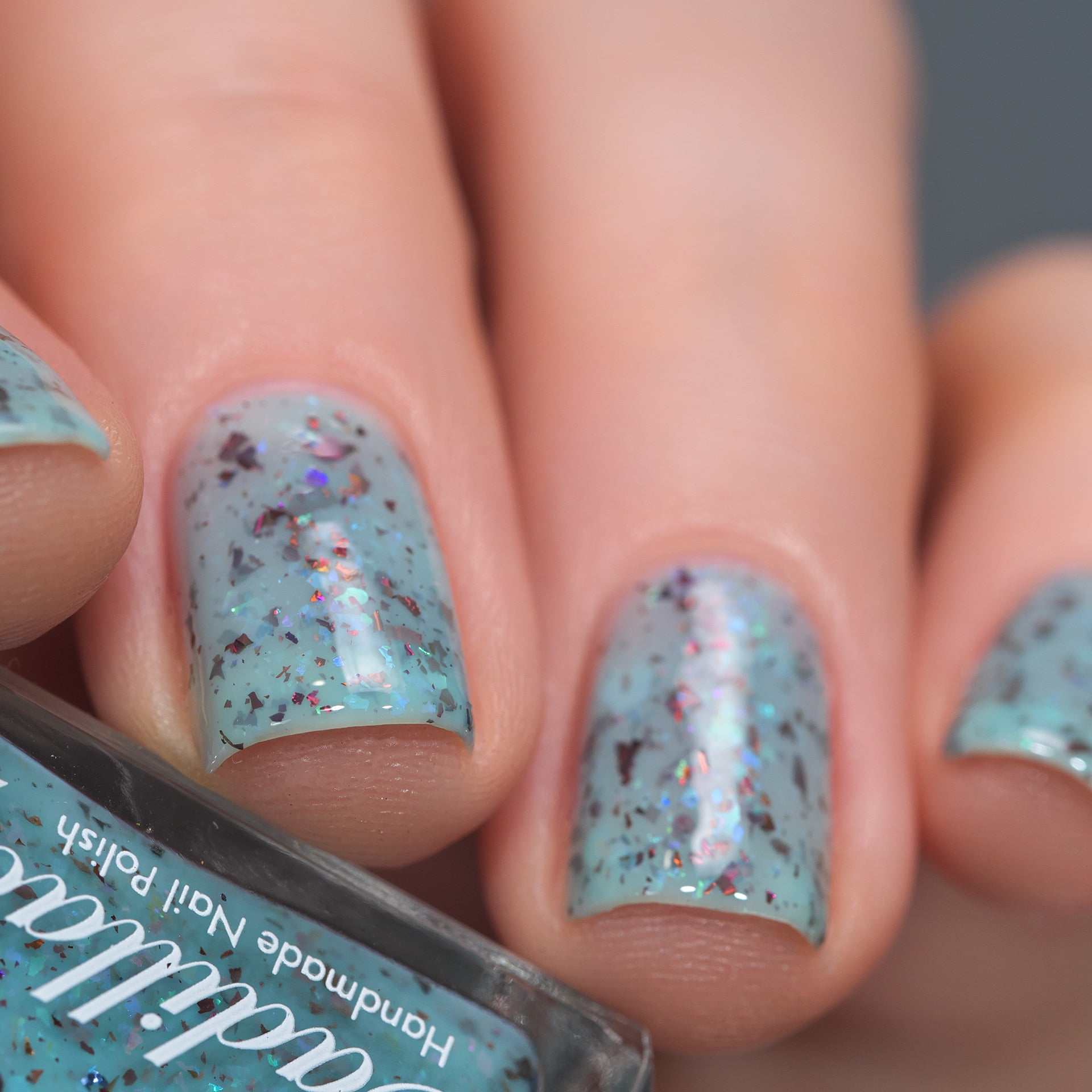 Cadillacquer Pastel Thoughts pastel teal purple chameleon iridescent crelly nail polish, swatched on four nails, light skin, studio lighting