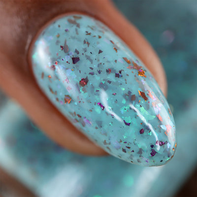 Cadillacquer Pastel Thoughts pastel teal purple chameleon iridescent crelly nail polish, macro single-nail swatch, light-medium skin, studio lighting