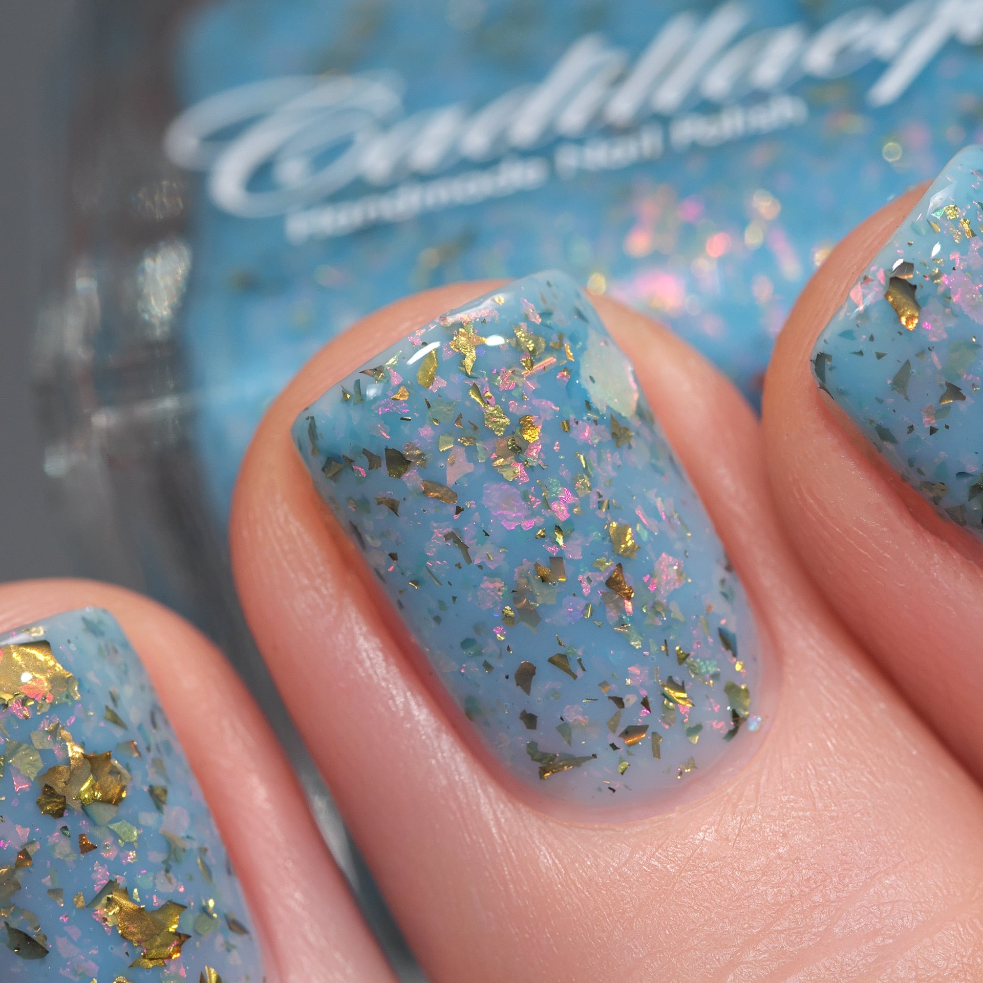 Cadillacquer Slow Mornings light blue gold chameleon iridescent crelly nail polish, swatched on four nails, light skin, studio lighting