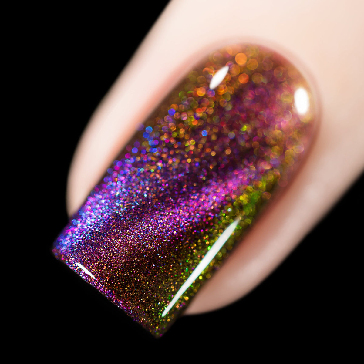 Close-up of Cadillacquer The Ones Who Live nail polish showing purple magnetic line and warm shimmer shift, swatched by @rafinails