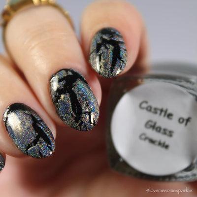 Castle of Glass (Crackle) by Danglefoot Nail Polish, silver holographic crackle topper on a light skin tone hand