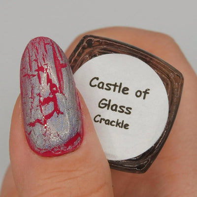 Castle of Glass (Crackle) by Danglefoot Nail Polish, silver holographic crackle topper on a light skin tone hand