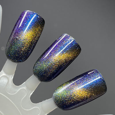 Horse by Dam Nail Polish, blue-gold multichrome magnetic with violet-purple shift and bronze-to-gold magnetic streak over deep navy-black base, swatch stick