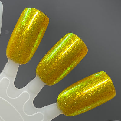 Monkey by Dam Nail Polish, deep golden yellow base with dense yellow-to-green duochrome shimmer, swatch stick